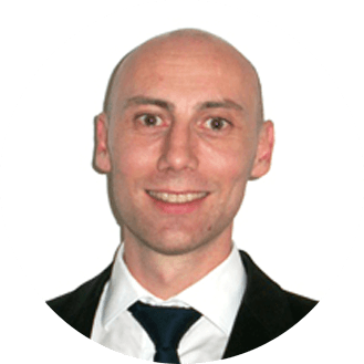 Person smiling in a business suit with a white background.