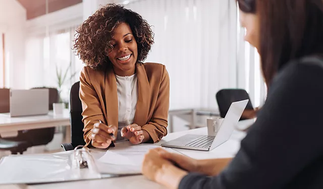 Two people having a business meeting in an office